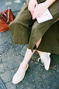 Person Wearing Green Skirt and Pair of White Low Top Sneakers thumbnail