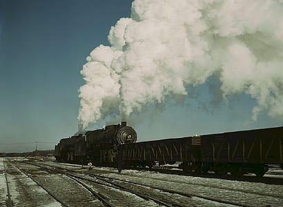 black train under blue sky thumbnail