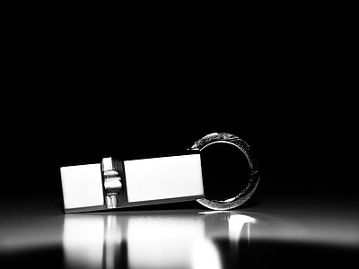 white and silver-colored keychain thumbnail