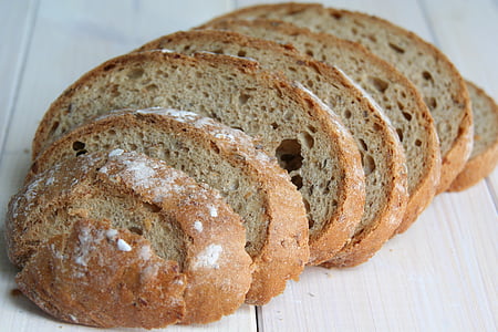 closeup photo of bread on brown wooden surface thumbnail