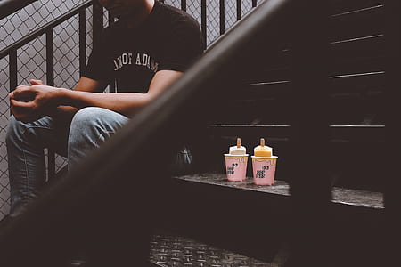 man sitting on staircase thumbnail