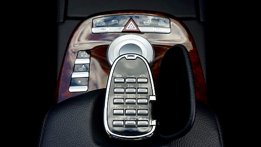black vehicle FM transistor plugged inside vehicle thumbnail