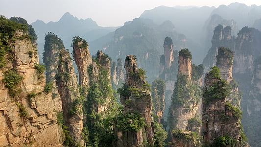 brown and green rock formation during daytime thumbnail