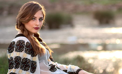 woman in black and white floral long-sleeved shirt thumbnail