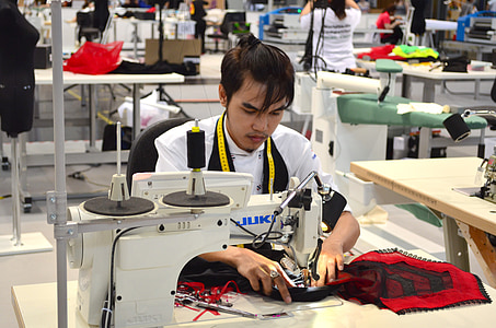 man sewing using Juki electronic sewing machine thumbnail