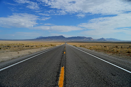 asphalt road between desert thumbnail
