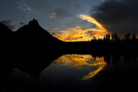silhouette of trees and mountain thumbnail