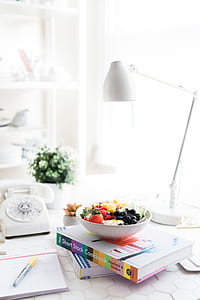 bowl of fruit on books thumbnail