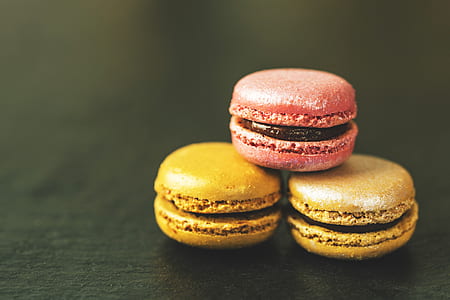 two yellow and one pink French macaroons thumbnail