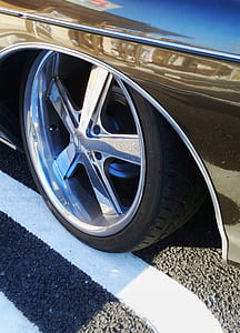 closeup photo of chrome 5-spoke vehicle wheel and tire thumbnail
