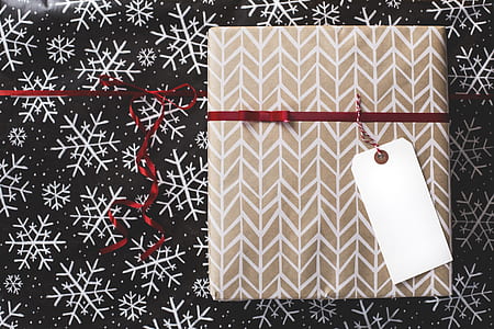 flat lay photography of brown and white album and red ribbon thumbnail