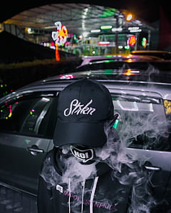 person wearing black hat thumbnail