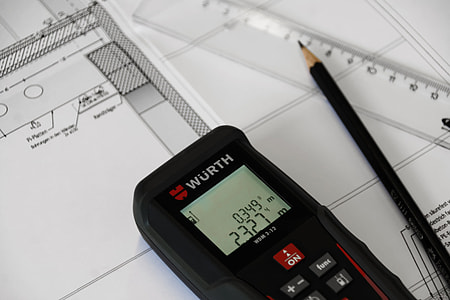 black Wurth device at 2.327 m beside black pencil thumbnail