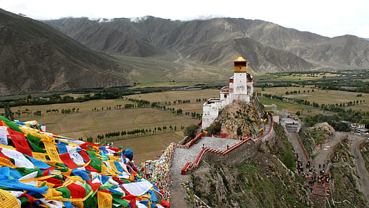 white painted house on mountain thumbnail