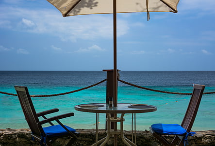patio table set facing the sea thumbnail