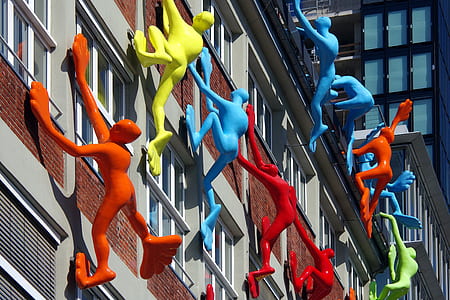 plastic toy climbing on wall thumbnail