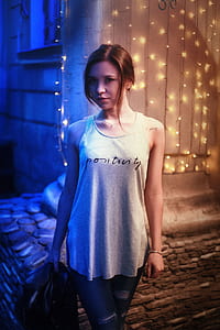 woman wearing gray sleeveless top thumbnail