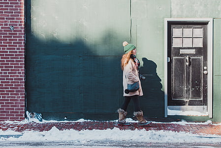 woman walking on sidewalk thumbnail