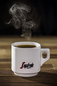 white ceramic coffee mug filled with hot liquid thumbnail
