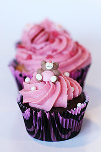 selective focus photography of pink and black cupcake thumbnail