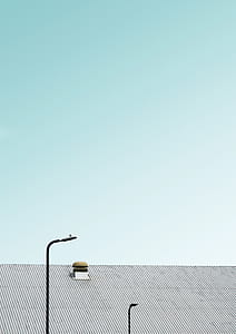 post lamps near gray roofed building thumbnail