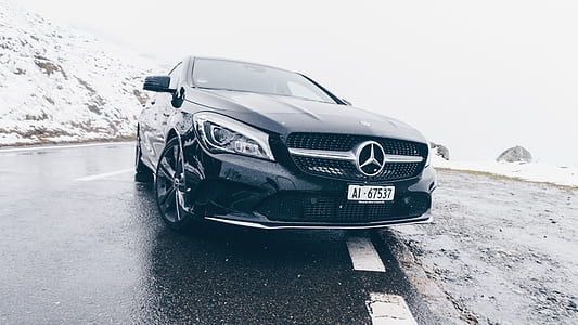 black Mercedes-Benz car in snowy area thumbnail