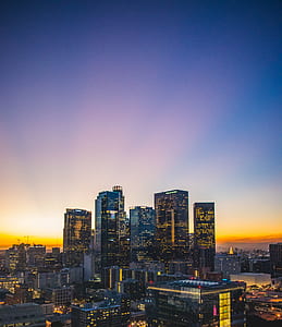 skyline photography of city during sunset thumbnail