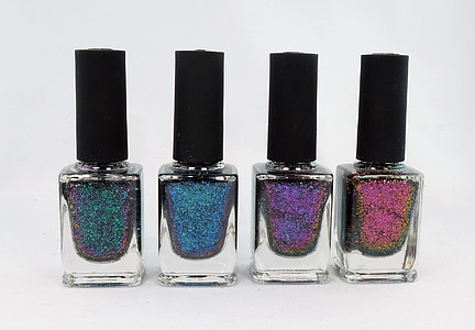 four assorted-color glitter nail polishes thumbnail