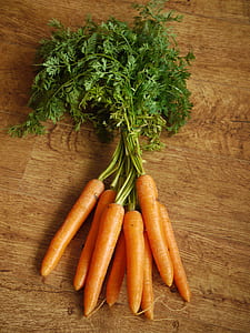 orange carrot on brown wooden top thumbnail