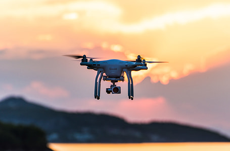 white drone with camera focus photography thumbnail