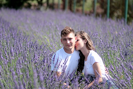 shallow focus photography of man and woman in white shirts at lavender field during daytime thumbnail