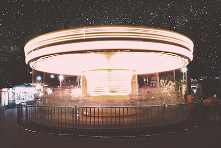 round lighted building during nighttime thumbnail