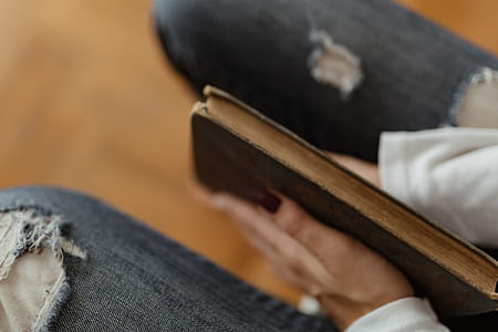 Beautiful young woman reading a book thumbnail