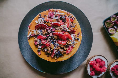 plate of baked cake beside red strawberries thumbnail