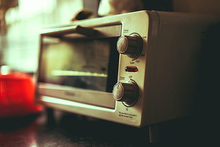 white toaster oven on brown wooden table thumbnail