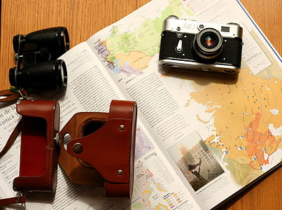 black and gray camera on white book thumbnail