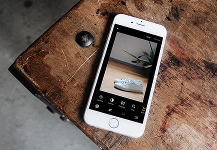 silver iPhone 6 on brown wooden table thumbnail