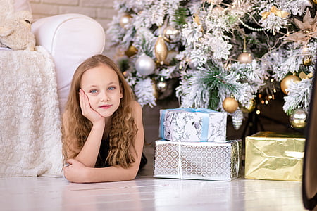 gray, gold, and white Christmas gifts on white ceramic flooring thumbnail