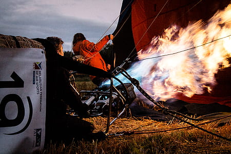two person near red hot air balloon thumbnail