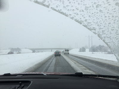 cars on road during snow thumbnail