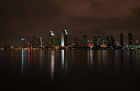 cities scape of high rise buildings photo at night thumbnail