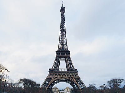 low angle photography of Eiffel Tower under cloudy skies thumbnail