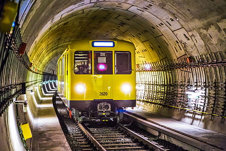 Yellow and Black Train Under Tunnel thumbnail