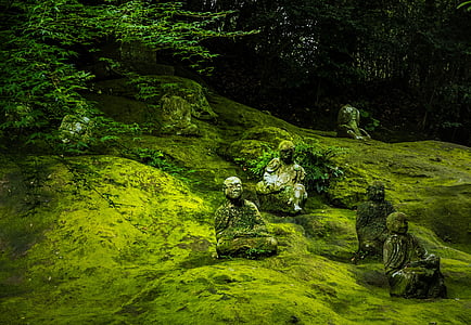 statues with molds beside tall trees thumbnail