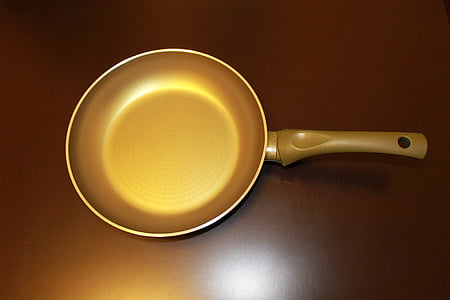 frying pan on brown surface thumbnail