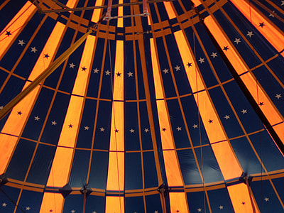 low angle photography of inside yellow and blue star print structure thumbnail