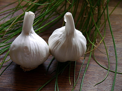 two white onions on brown surface thumbnail