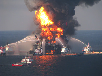 oil rig burning surrounded with rescue ship thumbnail