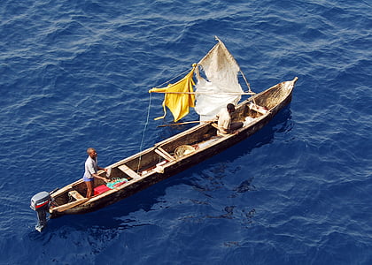 man riding on brown wooden boat thumbnail
