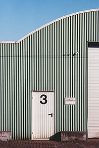 white and black striped painted shed thumbnail